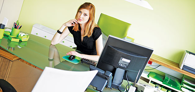 Women stting at chair by computer